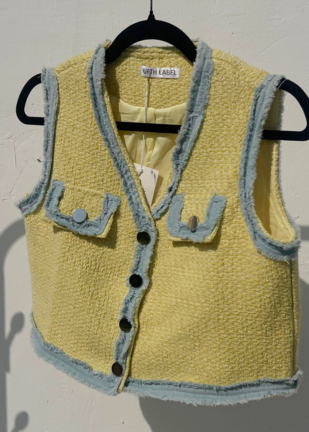 Yellow sleeveless jacket with denim